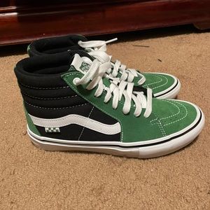 Green and black vans high tops